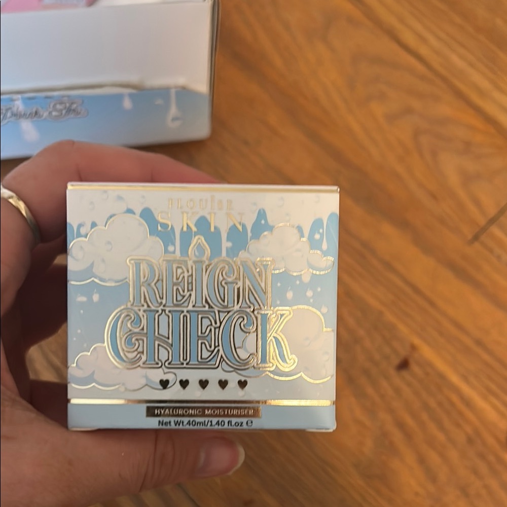 Trixie Cosmetics Reign Check Hyaluronic Moisturizer in Blue and White